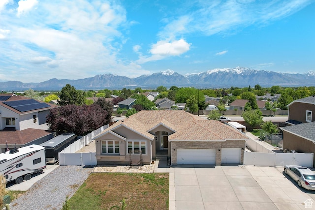 8793 S Mountain Vista Dr, West Jordan, UT 84081 - view of front of home featuring a mountain view, an attached garage, and concrete driveway