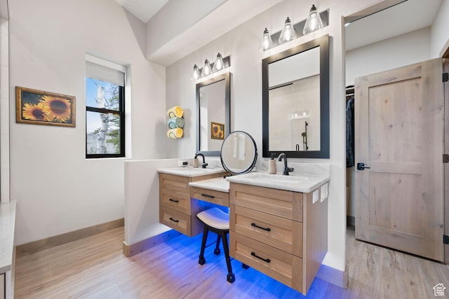 466 N Elk Dr, Brian Head, UT 84719 - bathroom featuring wood finished floors, two vanities, and baseboards
