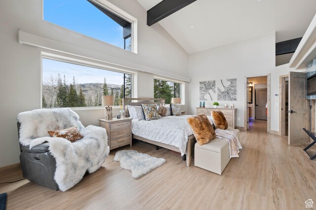 466 N Elk Dr, Brian Head, UT 84719 - bedroom featuring high vaulted ceiling, beam ceiling, light wood-type flooring, and baseboards