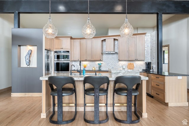 466 N Elk Dr, Brian Head, UT 84719 - kitchen with light brown cabinetry, light wood-style floors, stainless steel double oven, and decorative backsplash