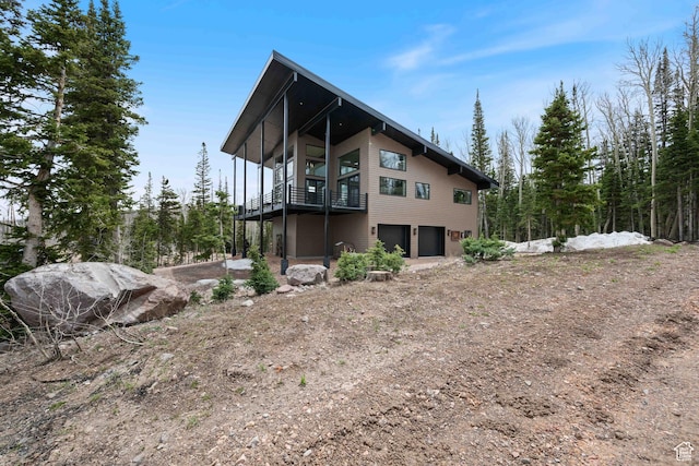 466 N Elk Dr, Brian Head, UT 84719 - view of property exterior featuring an attached garage and driveway