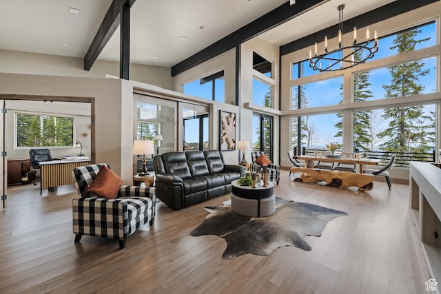 466 N Elk Dr, Brian Head, UT 84719 - living area with an office area, wood finished floors, a chandelier, and beam ceiling