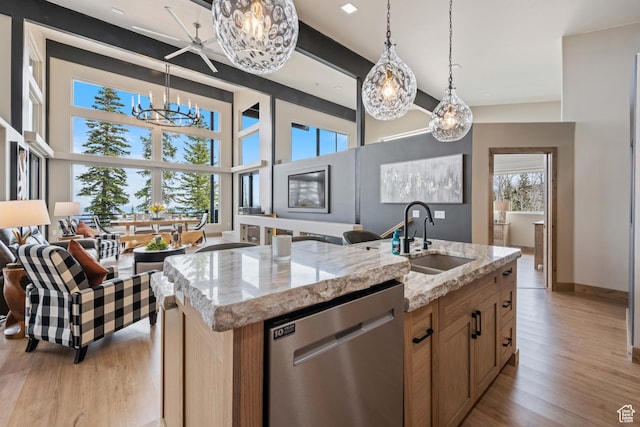 466 N Elk Dr, Brian Head, UT 84719 - kitchen with dishwasher, a sink, a chandelier, light wood-style flooring, and light stone counters