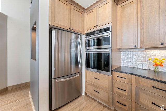 466 N Elk Dr, Brian Head, UT 84719 - kitchen with stainless steel appliances, light brown cabinetry, light wood-style floors, and tasteful backsplash