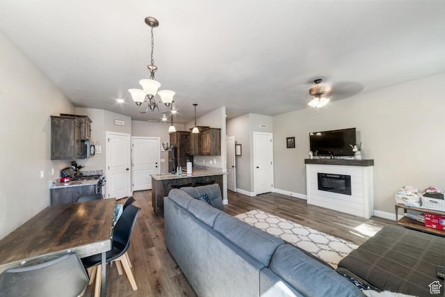 404 W 1325 N Unit L5, Cedar City, UT 84721 - living area with a chandelier, dark wood finished floors, and baseboards