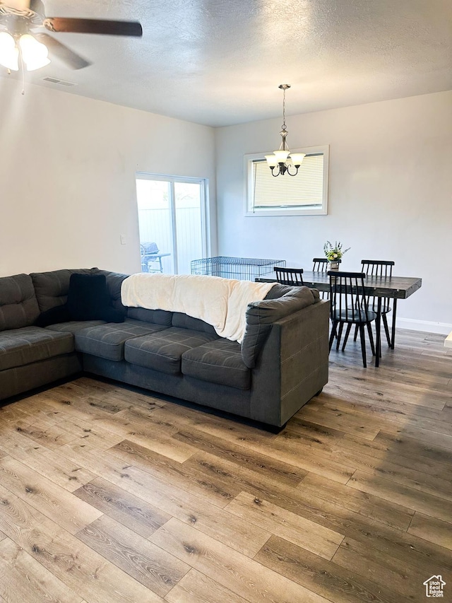 404 W 1325 N Unit L5, Cedar City, UT 84721 - living area with wood-type flooring, a ceiling fan, and a chandelier
