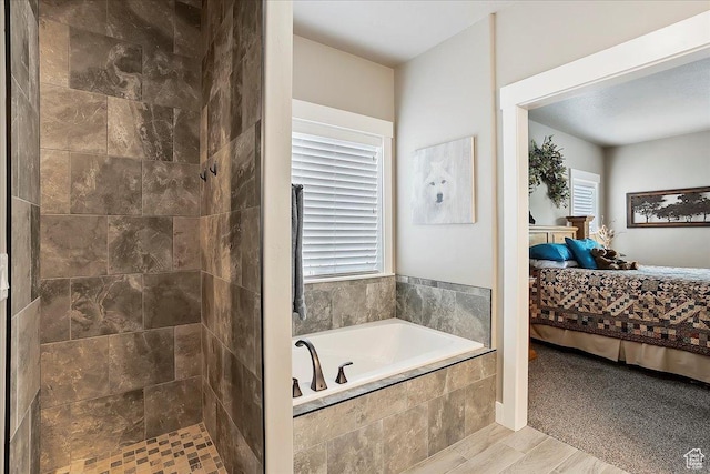 4548 N Sheep Creek Dr, Eden, UT 84310 - bathroom with ensuite bathroom, a garden tub, tiled shower, and wood finished floors
