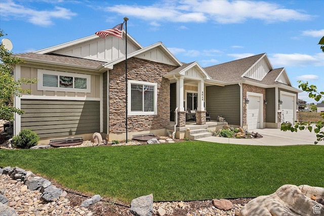 4548 N Sheep Creek Dr, Eden, UT 84310 - craftsman inspired home with board and batten siding, stone siding, driveway, a front yard, and an attached garage