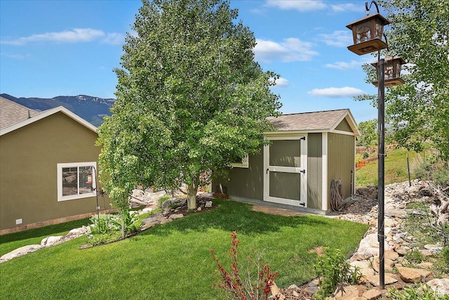 4548 N Sheep Creek Dr, Eden, UT 84310 - back of property featuring a yard and roof with shingles