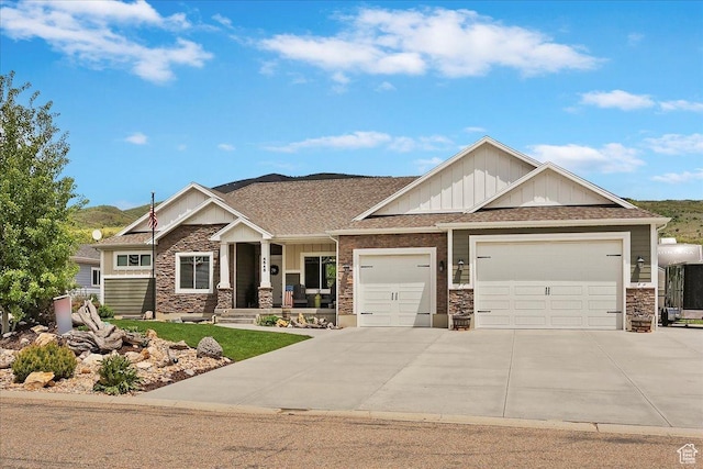 4548 N Sheep Creek Dr, Eden, UT 84310 - craftsman-style home featuring an attached garage, board and batten siding, concrete driveway, a porch, and roof with shingles