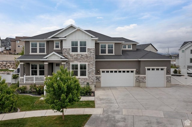 1407 W Fort Rock Dr, Saratoga Springs, UT 84045 - craftsman-style house with stone siding, driveway, stucco siding, and board and batten siding