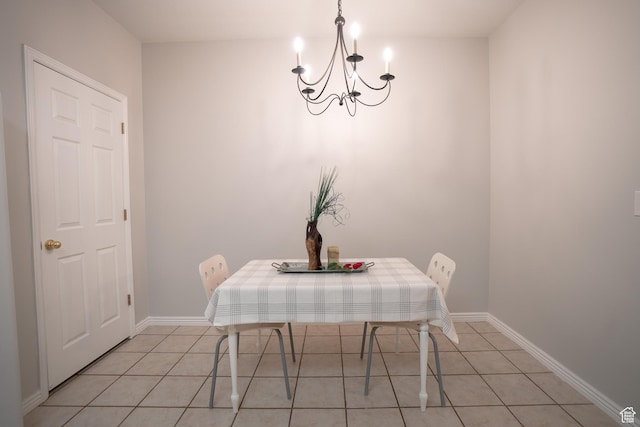 509 N Belmont Pl E Unit 171, Provo, UT 84606 - dining area featuring a chandelier, light tile patterned flooring, and baseboards