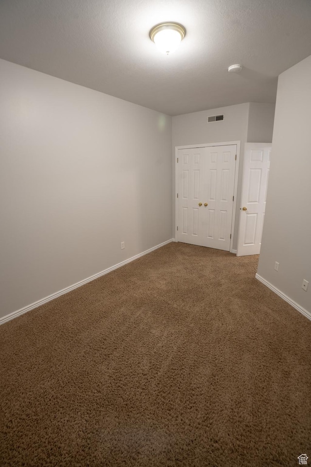 509 N Belmont Pl E Unit 171, Provo, UT 84606 - unfurnished room with baseboards, carpet, and a smoke detector