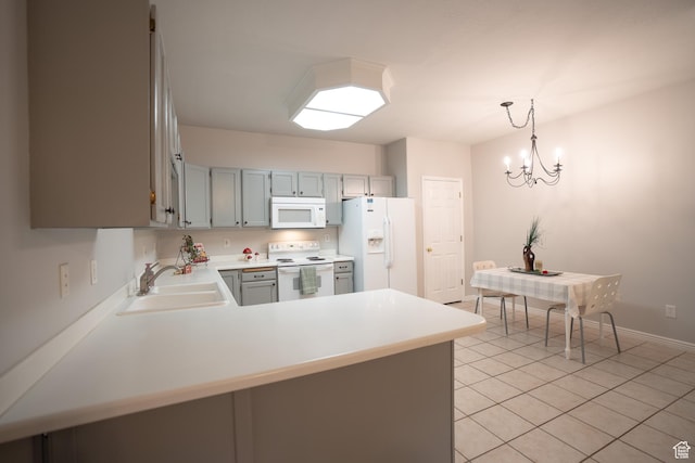 509 N Belmont Pl E Unit 171, Provo, UT 84606 - kitchen featuring white appliances, a sink, light countertops, light tile patterned floors, and a peninsula