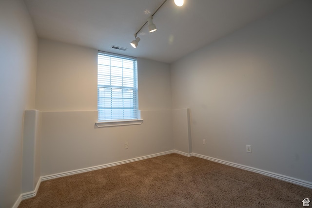 509 N Belmont Pl E Unit 171, Provo, UT 84606 - empty room with carpet flooring, rail lighting, and baseboards