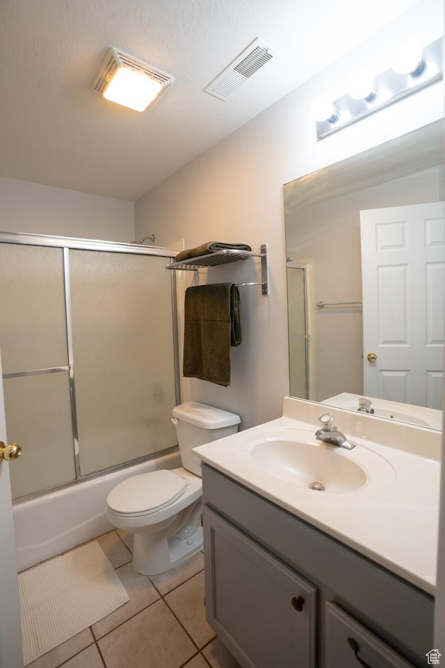 509 N Belmont Pl E Unit 171, Provo, UT 84606 - full bath with vanity, bath / shower combo with glass door, toilet, and tile patterned flooring