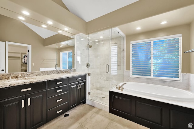 6782 S Courtland Ave, Cottonwood Heights, UT 84121 - bathroom with a stall shower, tile patterned floors, a garden tub, a spacious closet, and vaulted ceiling