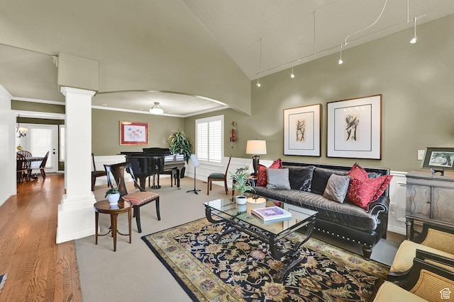 6782 S Courtland Ave, Cottonwood Heights, UT 84121 - living room featuring decorative columns, crown molding, attic access, arched walkways, and wood finished floors