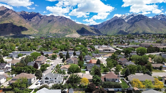 6782 S Courtland Ave, Cottonwood Heights, UT 84121 - aerial view of property and surrounding area with a mountainous background and nearby suburban area