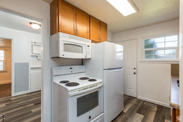 1006 E 300 N, Provo, UT 84606 - kitchen featuring white appliances, brown cabinets, dark wood finished floors, baseboards, and plenty of natural light