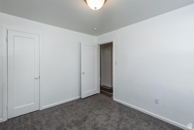 1006 E 300 N, Provo, UT 84606 - unfurnished bedroom featuring dark colored carpet and baseboards