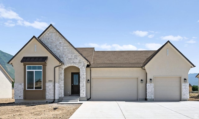 1002 E 400 N Unit 3, Salem, UT 84653 - french provincial home with stone siding, a garage, stucco siding, and concrete driveway