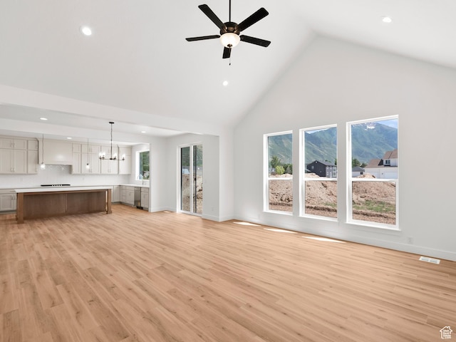 1002 E 400 N Unit 3, Salem, UT 84653 - unfurnished living room with high vaulted ceiling, recessed lighting, light wood-style floors, a ceiling fan, and a chandelier