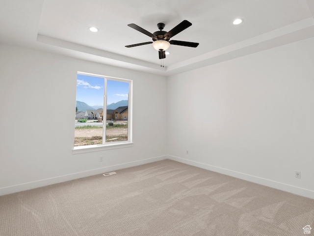 1002 E 400 N Unit 3, Salem, UT 84653 - empty room featuring a raised ceiling, light carpet, recessed lighting, and ceiling fan
