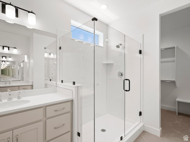 1002 E 400 N Unit 3, Salem, UT 84653 - bathroom with a stall shower, vanity, a walk in closet, and tile patterned floors