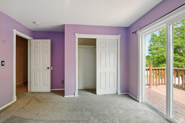 425 E 1200 N, Logan, UT 84341 - unfurnished bedroom with access to exterior, carpet, baseboards, and a closet