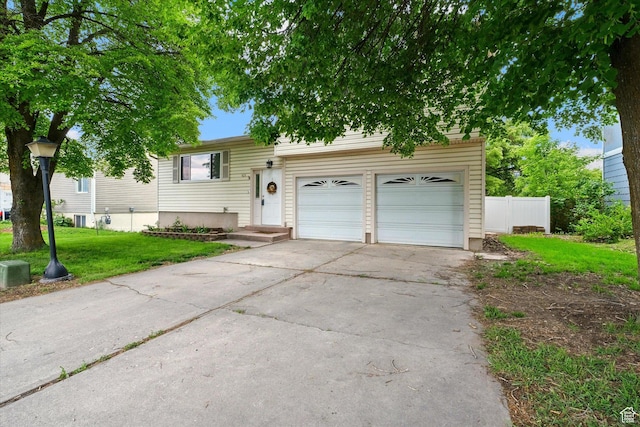 425 E 1200 N, Logan, UT 84341 - view of front of home with concrete driveway and an attached garage