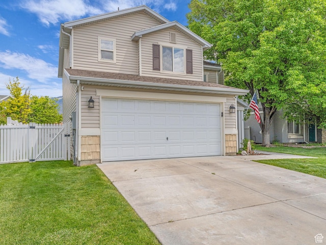 5472 Ardennes Way, Stansbury Park, UT 84074 - traditional-style home with a garage, driveway, and a gate