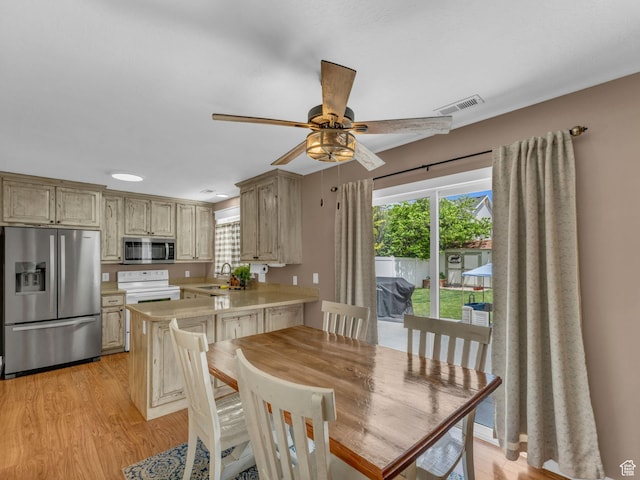 5472 Ardennes Way, Stansbury Park, UT 84074 - dining room with light wood-style floors, plenty of natural light, and ceiling fan