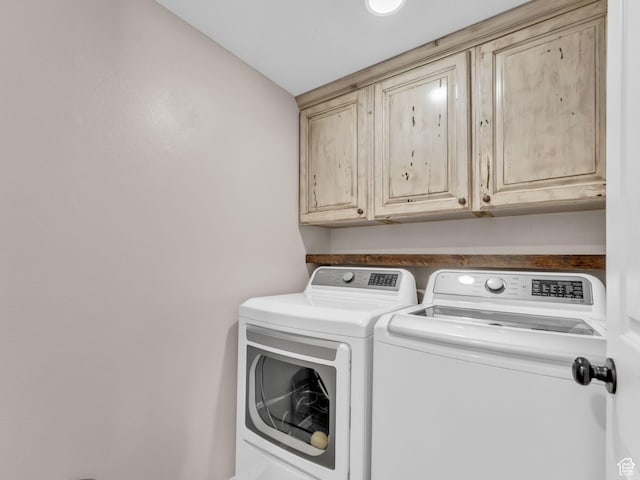 5472 Ardennes Way, Stansbury Park, UT 84074 - washroom featuring washer and clothes dryer and cabinet space