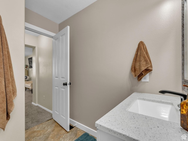 5472 Ardennes Way, Stansbury Park, UT 84074 - bathroom featuring vanity and baseboards