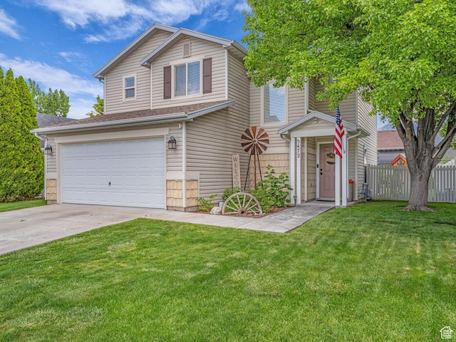 5472 Ardennes Way, Stansbury Park, UT 84074 - view of front of home featuring a garage and driveway