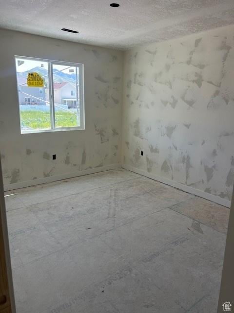 436 W Sapphire Dr Unit 7013, Tooele, UT 84074 - spare room with baseboards and a textured ceiling