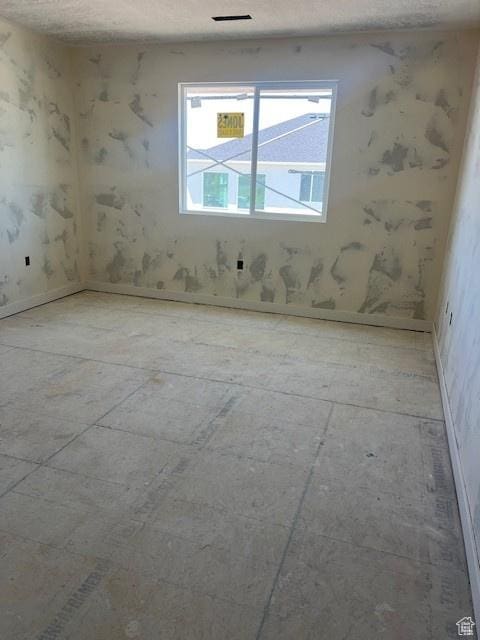 436 W Sapphire Dr Unit 7013, Tooele, UT 84074 - unfurnished room with a textured ceiling