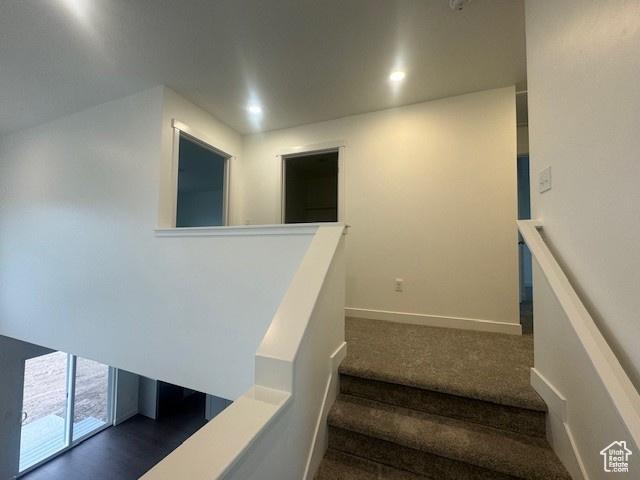 436 W Sapphire Dr Unit 7013, Tooele, UT 84074 - staircase featuring carpet flooring and baseboards