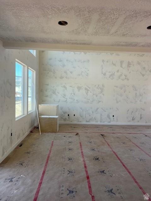 436 W Sapphire Dr Unit 7013, Tooele, UT 84074 - empty room featuring baseboards and a textured ceiling