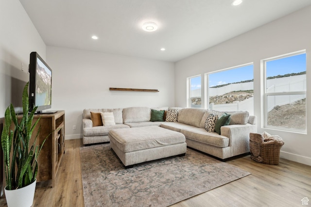 7936 N Bristlecone Rd, Eagle Mountain, UT 84005 - living room with baseboards, wood finished floors, and recessed lighting