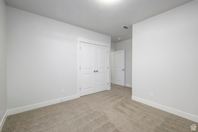 7936 N Bristlecone Rd, Eagle Mountain, UT 84005 - unfurnished bedroom with carpet floors, baseboards, and a closet