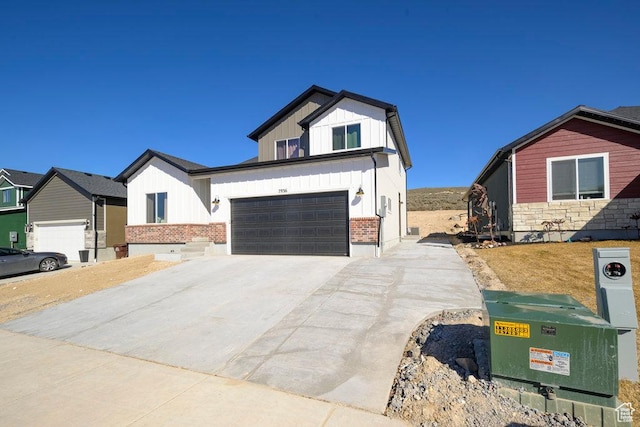 7936 N Bristlecone Rd, Eagle Mountain, UT 84005 - view of front of home featuring board and batten siding, driveway, and a garage