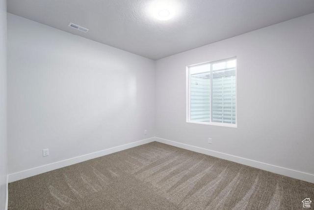 7936 N Bristlecone Rd, Eagle Mountain, UT 84005 - empty room featuring baseboards and carpet flooring
