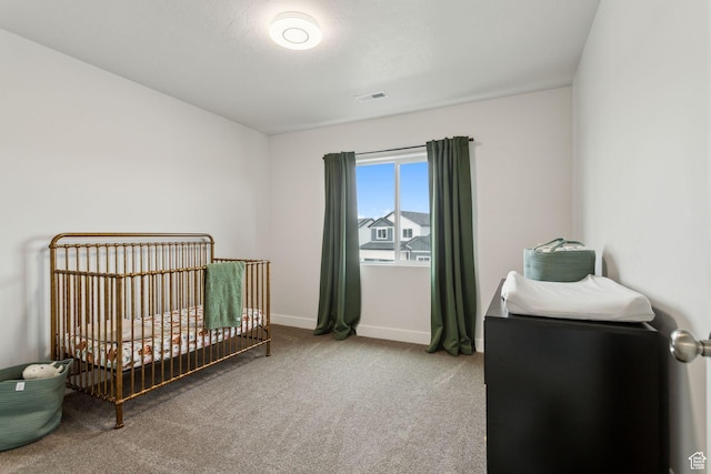 7936 N Bristlecone Rd, Eagle Mountain, UT 84005 - carpeted bedroom featuring a nursery area and baseboards