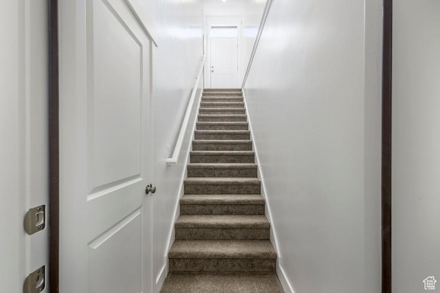 7936 N Bristlecone Rd, Eagle Mountain, UT 84005 - staircase featuring baseboards