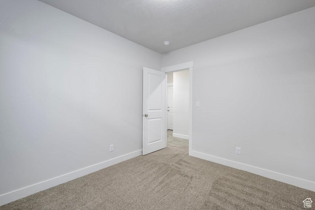 7936 N Bristlecone Rd, Eagle Mountain, UT 84005 - carpeted empty room featuring baseboards