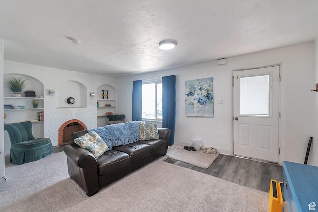 185 N 200 W, Delta, UT 84624 - living area featuring a brick fireplace, wood finished floors, and built in features