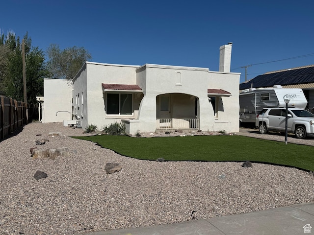 185 N 200 W, Delta, UT 84624 - mediterranean / spanish house featuring stucco siding, covered porch, and a chimney