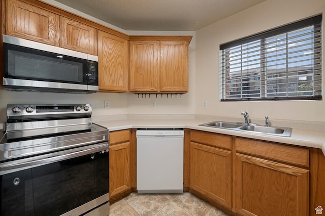 191 E Spencer Peak Way Unit I2, Draper, UT 84020 - kitchen with stainless steel appliances, a sink, and light countertops
